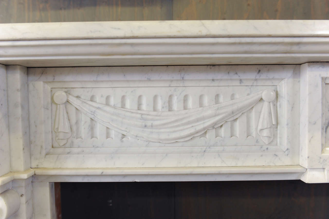 19th Century A 19th century French Neoclassical Carrara marble fireplace / mantle piece